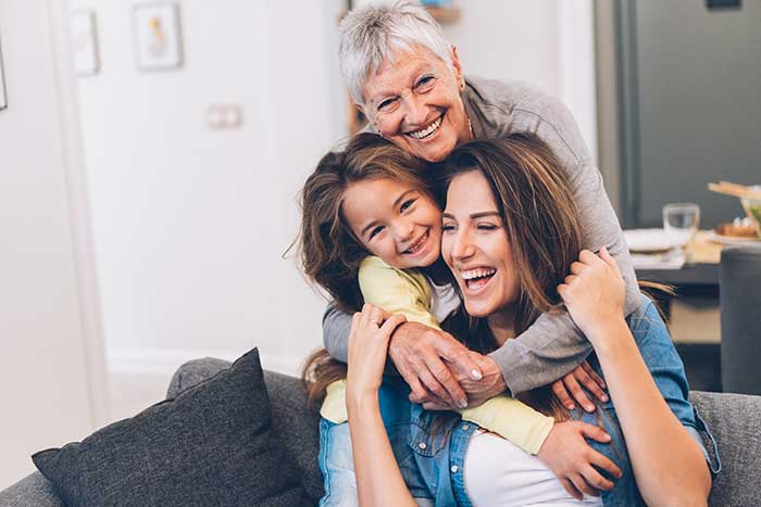 Girl happy with her Mummy and Grandmother